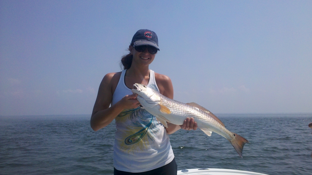 Beginner anglers enjoying a guided tarpon fishing trip in Tampa Bay