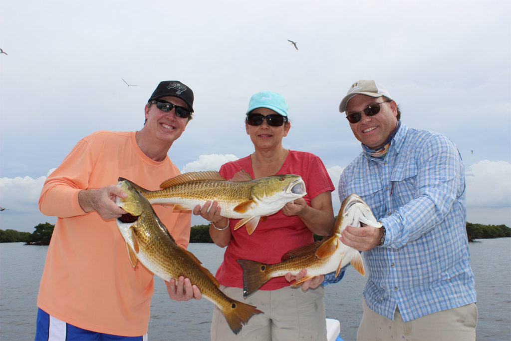 Arriving early for a Tampa Bay fishing charter and preparing gear at the dock